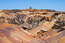 Parys Mountain copper mine showing The Great Opencast and the old windmill in the background, near Almwych, Anglesley, Wales, UK. June, 2023.