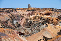 Parys Mountain copper mine showing The Great Opencast and the old windmill in the background, near Almwych, Anglesley, Wales, UK. June, 2023.