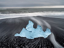 Ice formation on black, volcanic beach, Jokulsarlon, Iceland. August, 2023.