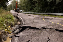 Damaged road, washed away by one night&acute;s rainfall, Follo, Norway. August, 2023.