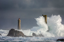 Autumn storm waves smashing against Nividic Lighthouse on Ouessant Island, Brittany France. October, 2023..