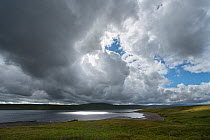 Clouds moving over Cow Green Reservoir, Upper Teesdale, Northern Pennines, County Durham, England, UK, July, 2017.
