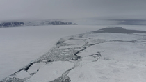 Drone shot revealing pack ice at edge of ice sheet, Mittimitalik, Baffin Island, Canada.