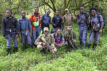 Rangers, guides, guards and porters group portrait, Mgahinga Gorilla National Park, Uganda. February, 2023.