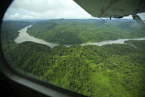 View from window of aeroplane over lowland rain forest along the Mamberamo River, West Papua. October, 2008.