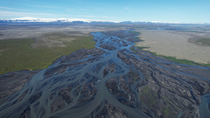 Drone tracking shot of braided glacial river, south Iceland. June.