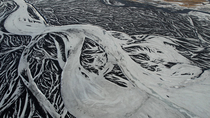 Aerial shot of frozen braided glacial river, south Iceland. February.