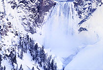 Lower Yellowstone Falls in snow, Yellowstone National Park, Wyoming, USA.
