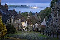 View down Gold Hill at night, Shaftesbury, Dorset, England, UK. August, 2023.