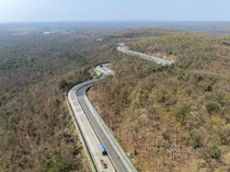 Drone shot of National Highway NH-44, the longest national highway in India, seen here passing through Pench Tiger Reserve, Madhya Pradesh, India.
