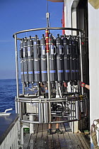 Rosette water sampler (also known as a CTD-rosette or carousel) equipped with a CTD system for measuring conductivity, temperature and depth, being brought aboard the German research vessel SONNE, Cru...