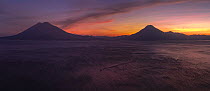 Sunset at Lake Atitlan with Atitlan, Toliman and San Pedro volcanoes in the distance, viewed from Panajachel, Solola, Guatemala. January, 2024.