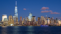 Timelapse, from day to night, looking across the Hudson River at One World Trade Center and Downtown Manhattan,  New York City, USA.