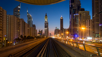 Timelapse looking out of the front of a train on the elevated Dubai Metro System, Dubai, UAE.