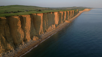 Drone tracking shot of West Bay Cliffs, Jurassic Coast, Dorset, UK.