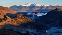 Aerial shot of Derwentwater, Borrowdale valley and the Skiddaw mountain range, Keswick, Lake District National Park, Cumbria, UK.