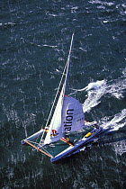 The 120 ft maxi cat "Playstation" with Steve Fossett at the helm at the start of her Newport - Bermuda record breaking run in 40 knots of breeze, Newport, Rhode island, USA.