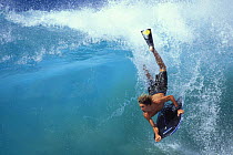 Bodyboarder rides a wave in Hawaii