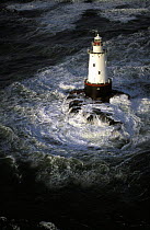 The Sakonnet Point lighthouse off Rhode Island on a stormy winters day, February, USA