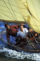 The crew of 8m classic yacht "Esterel" watching for the mark during racing in La Nioulargue, St Tropez, France.