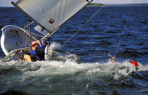 Man capsizing a dinghy