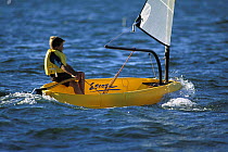 Young boy sailing an plastic roto moulded Escape dinghy. ^^^ These boats are aimed at beginners and provide an inexpensive solution to getting children out on the water.