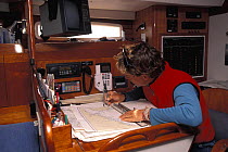 Passage planning at the chart table of a cruising yacht.