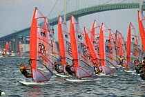 Mistral class windsurfing race start during the Youth World Championships under the Newport Bridge, Rhode Island, USA