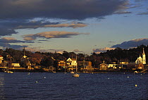 Yachts moored in Boothbay Harbor at sunset, Maine, USA.