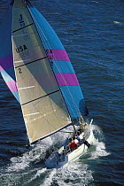 A J90 sailing fast on a tight reach with the asymmetric spinnaker off Newport, Rhode Island, USA.