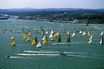 A record number of 12 metre yachts starting the Round the Island race during the America's Cup Jubilee held off Cowes, Isle of Wight, 2001.