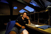 Ellen MacArthur at the navigation station on board "Kingfisher" in which she made the record-breaking voyage from Plymouth, UK to Newport, Rhode Island, USA in 2000.