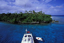 Snorkeling off the back of an 88 foot Tripp designed sloop, "Shaman", in the Vava'u group of islands, Tonga, South Pacific.