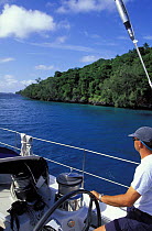 Navigating 88ft yacht "Shaman" through the shallow waters of the Vava'u group of islands, Tonga, South Pacific.