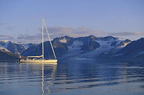 88ft sloop "Shaman", anchored near mountains in Spitsbergen, Svalbard, Norway, 1998. Property Released.