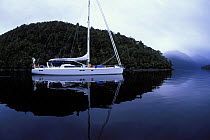 88ft yacht "Shaman" motoring through fjords of South Island, New Zealand. Property Released.