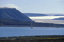 The 88ft sloop "Shaman" anchored beneath the mountains of Spitsbergen, Svalbard, Norway