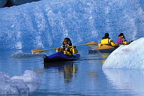 Kayaking amongst turquoise icebergs at the foot of Bear Glacier, Kenai Fjords National Park, Alaska. 2001.