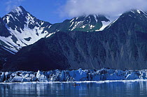 Kayaking beneath mountains, Bear Glacier, Kenai Fjords National Park, Alaska. 2001.
