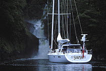 Nosing up to a waterfall in Alaska on 88ft sloop "Shaman" 2001