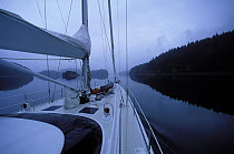 88ft sloop "Shaman" on calm waters in Fjordland, South Island, New Zealand. 2001. Property Released.