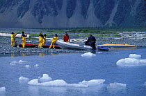 Crew of "Shaman" preparing for a kayak trip on Bear Glacier beach, Alaska.2001