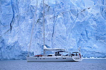 88ft sloop "Shaman" beneath a glacier in Alaska, USA 2001