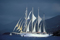 Clipper ship "Flying Cloud" beneath stormy skies during Antigua Classics Week, Caribbean.