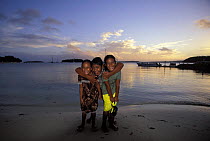 Local children on the beach at sunset in the Vava'u group, Tonga, Pacific Ocean Islands. 2000