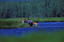 Couple exploring the Acadia National Park by canoe, Maine, USA.