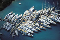 Superyachts line the pontoons of Falmouth Harbour in Antigua, Caribbean.