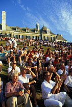 Members on the lawn of the New York Yacht Club's clubhouse, Harbour Court, on Newport Harbour, Rhode Island, celebrate the club's centennial in 1986.