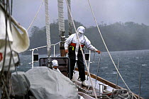 Crew working on the deck of "Sariyah" in windy conditions in the southern Chilean channels.