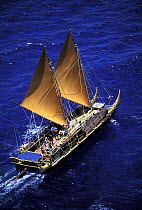 Traditional Hawaiian catamaran tourist boat off Honolulu, Hawaii.